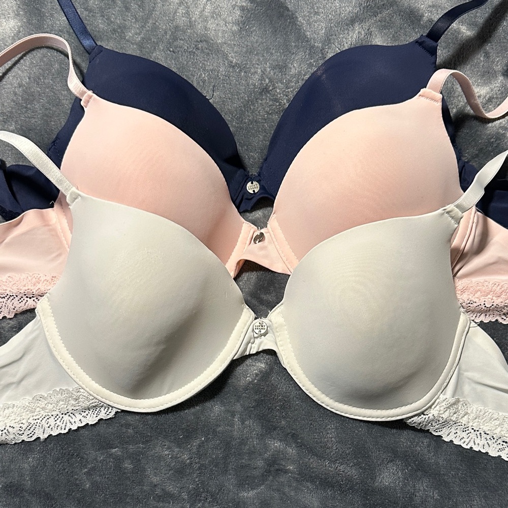NWOT 3-Pack size 36B Lucky Brand Women's Lace Trim Bras - Navy, Pink, & Cream.